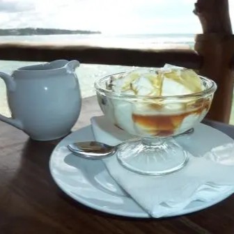 A sweet and tangy yogurt-like dish made from buffalo milk, drizzled with a rich, natural syrup from the Kithul palm.