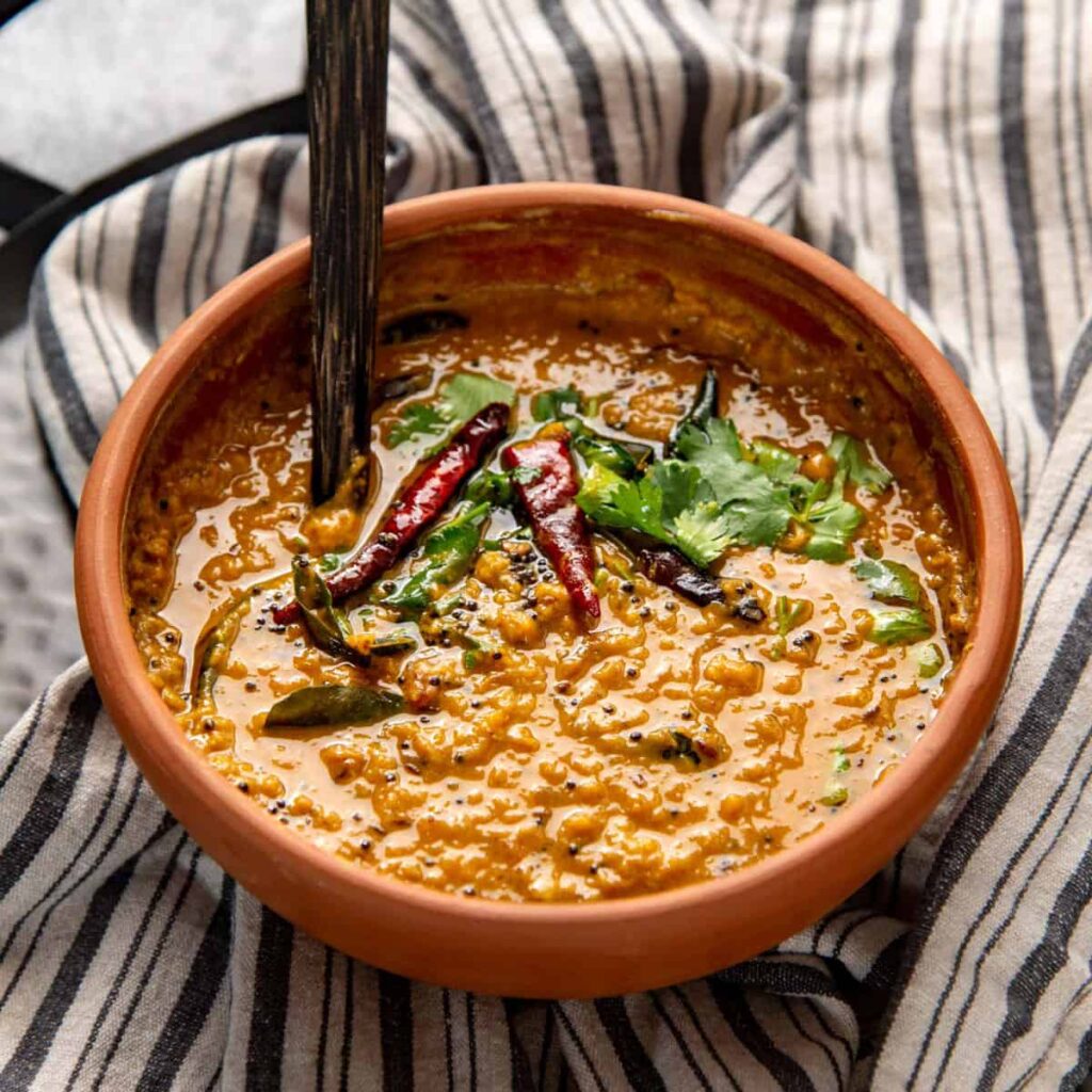 A creamy lentil curry made with coconut milk, curry leaves, onions, and spices. It's a mild and comforting dish that pairs well with everything.