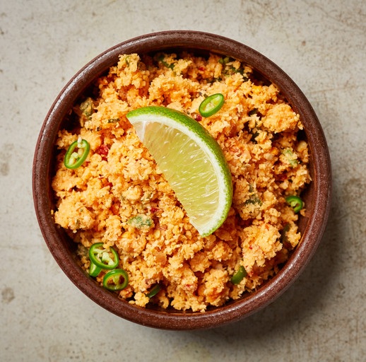 A fiery and fresh relish made from freshly grated coconut, red onions, dried chili flakes, lime juice, and salt. It's a must-have with almost every Sri Lankan meal.